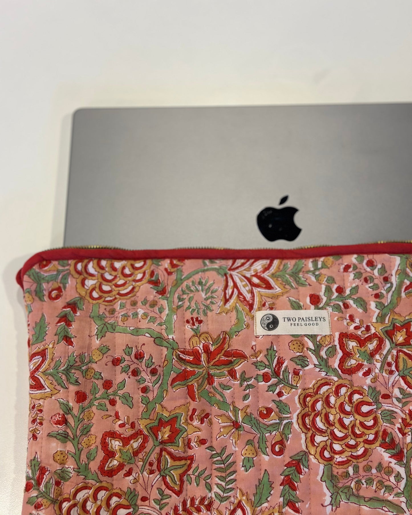 Laptop with floral patterned cover on a white background