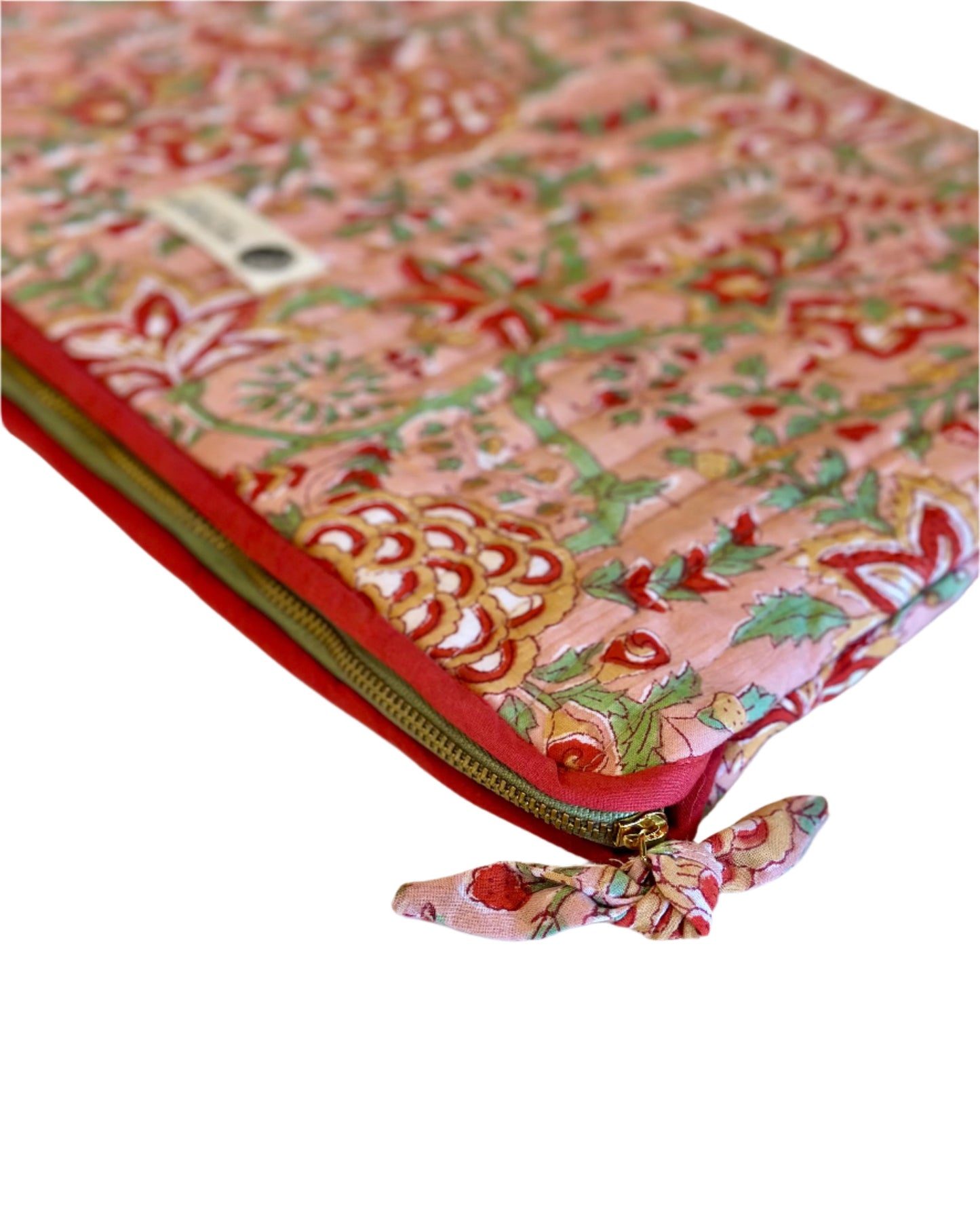 Decorative pouch with floral pattern and red zipper on a white background