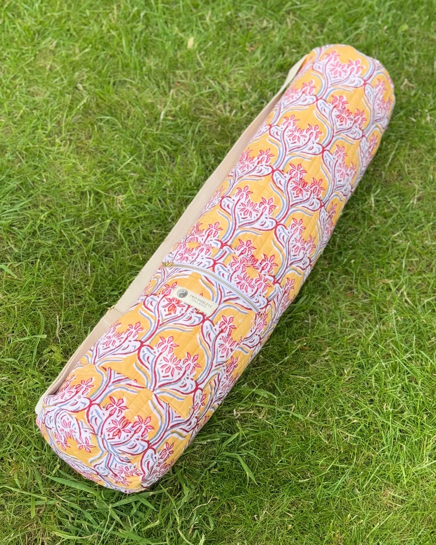 yoga mat cover with floral pattern on grass