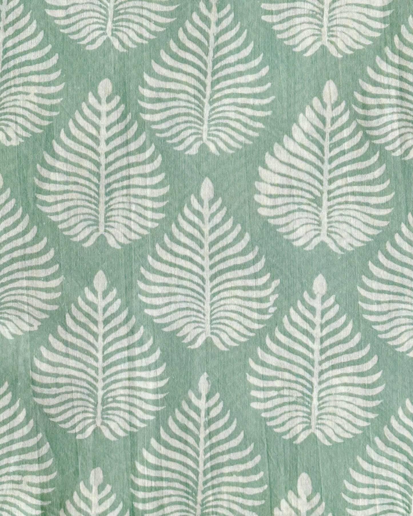 A swatch of the Fern Garden cotton fabric in sage green, showing the detailed white fern pattern