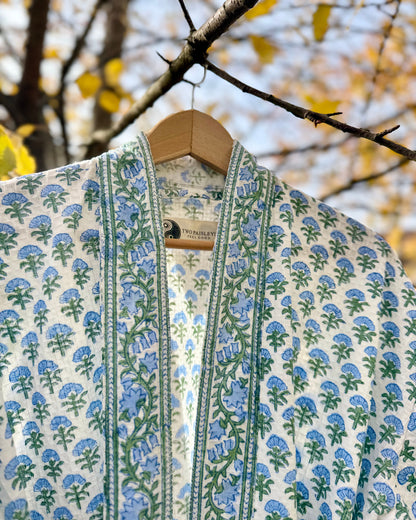 Close-up detail of the 'Blue Blossom' waffle robe collar, showing the 'Two Paisleys' brand label.