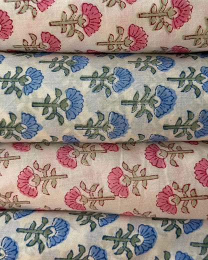 Floral fabric swatches with pink, blue, and green patterns.