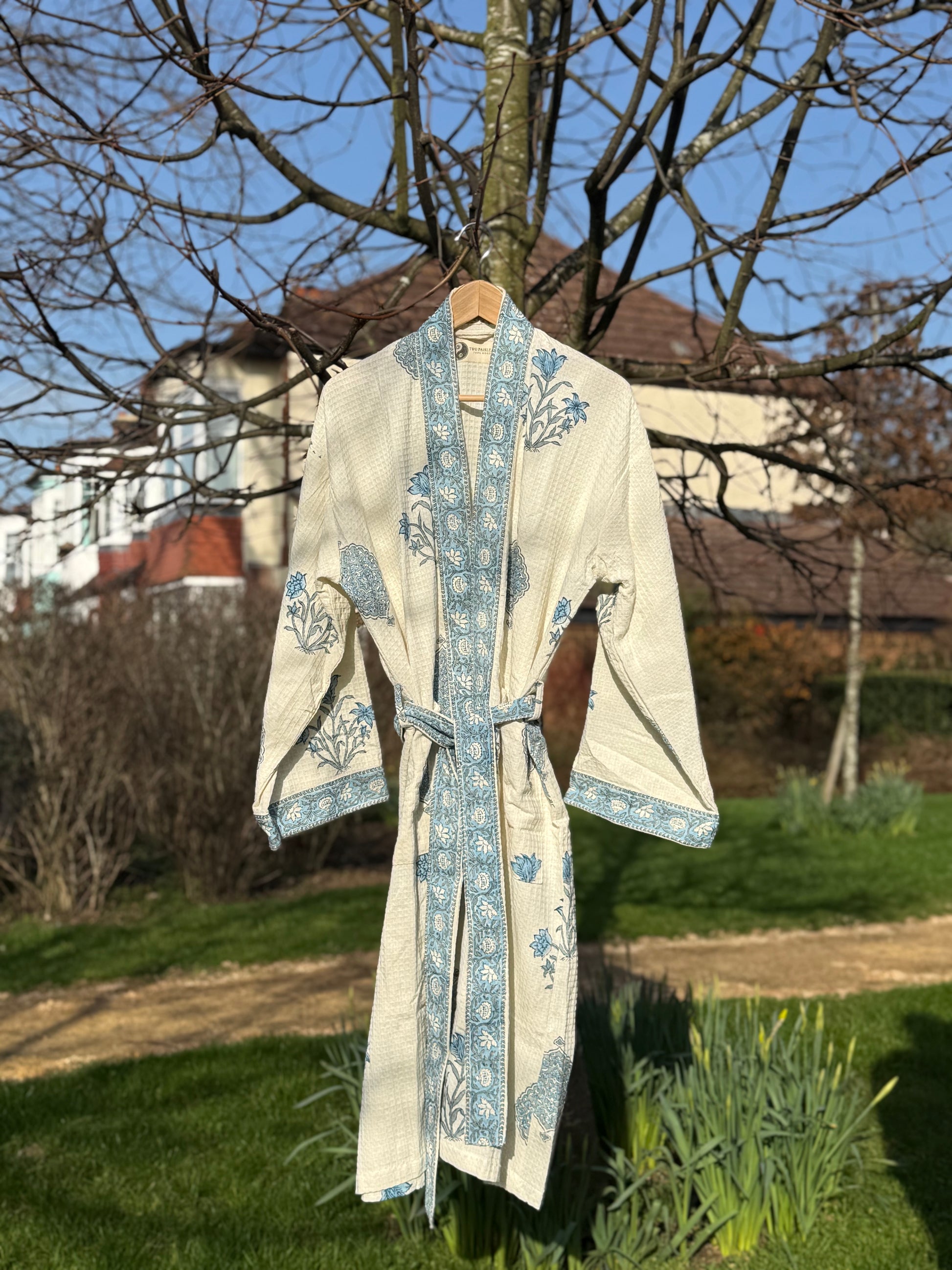 Dusky blue floral motifs  hand block printed on soft cream waffle full front view