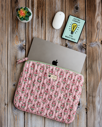 Blush Floral quilted laptop sleeve on a rustic wooden desk with notebook, mouse and succulent, showcasing a handmade cotton laptop case by Two Paisleys