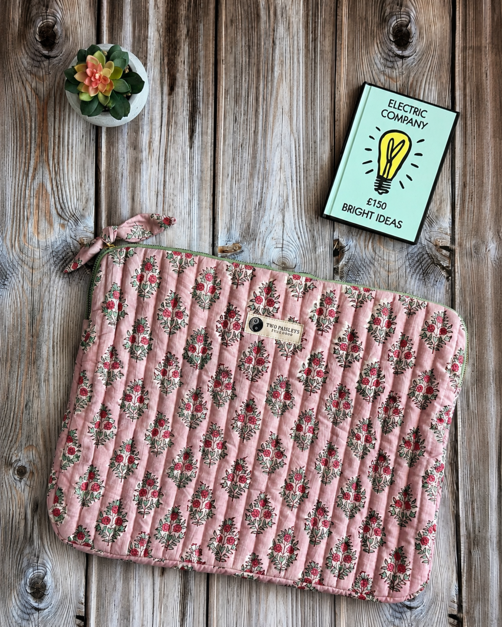 Handmade blush floral quilted cotton laptop sleeve by Two Paisleys with hand block printed pink floral design and premium padded protection.