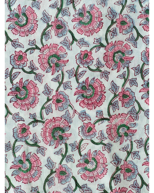A detailed close-up of the Floral Whispers Hand Block Print Cotton Fabric, showcasing the romantic floral jaal pattern in dusty rose and muted blue