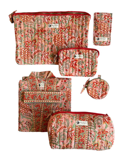 Set of matching  floral-patterned bags on a white background
