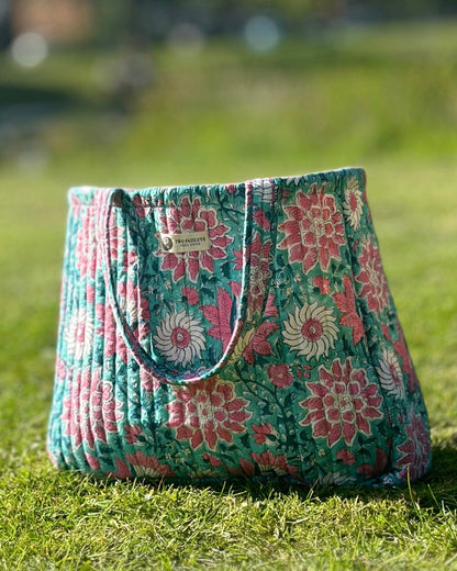 Floral patterned bag on grass