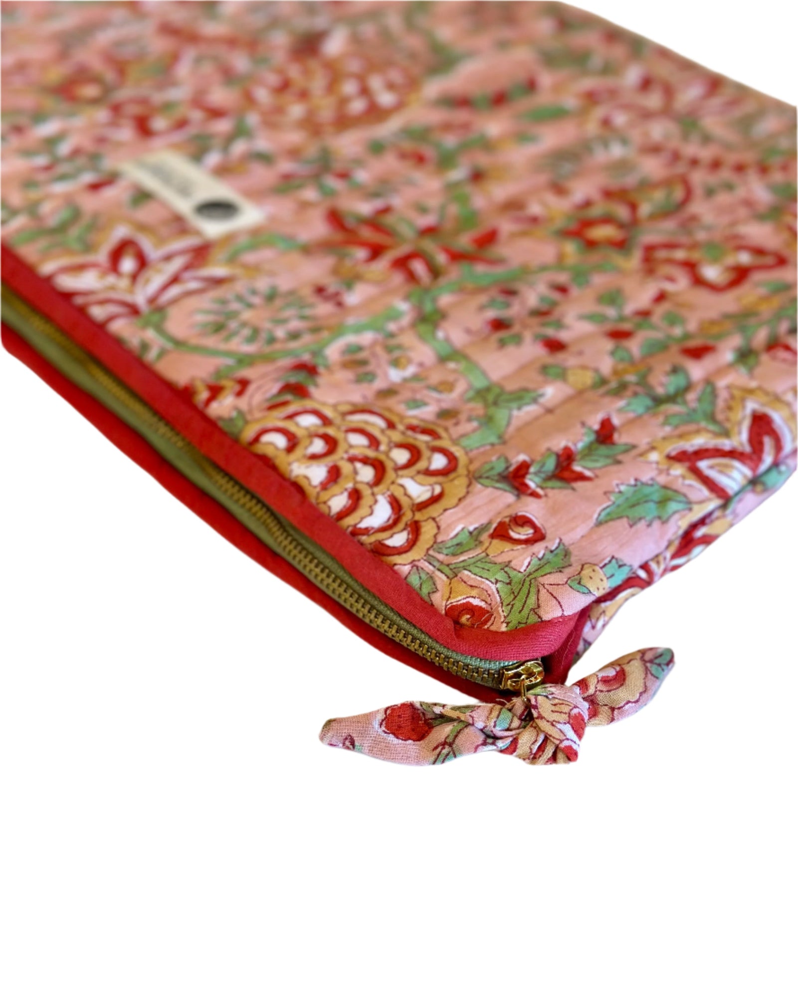 Decorative pouch with floral pattern and red zipper on a white background