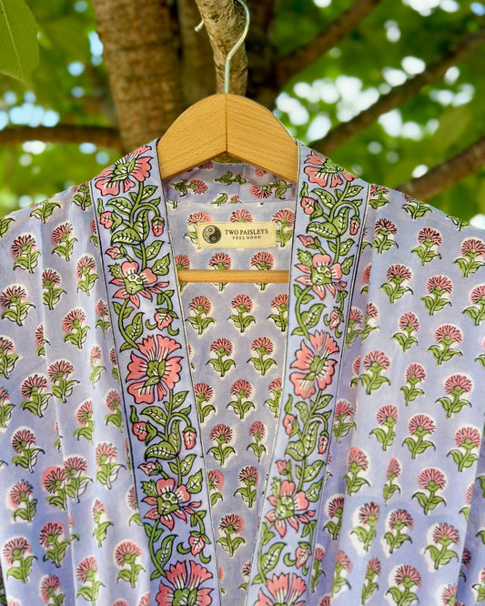 Close-up of collar and label on a lilac floral block printed cotton dressing gown, showing intricate hand block print detail and Two Paisleys branding.