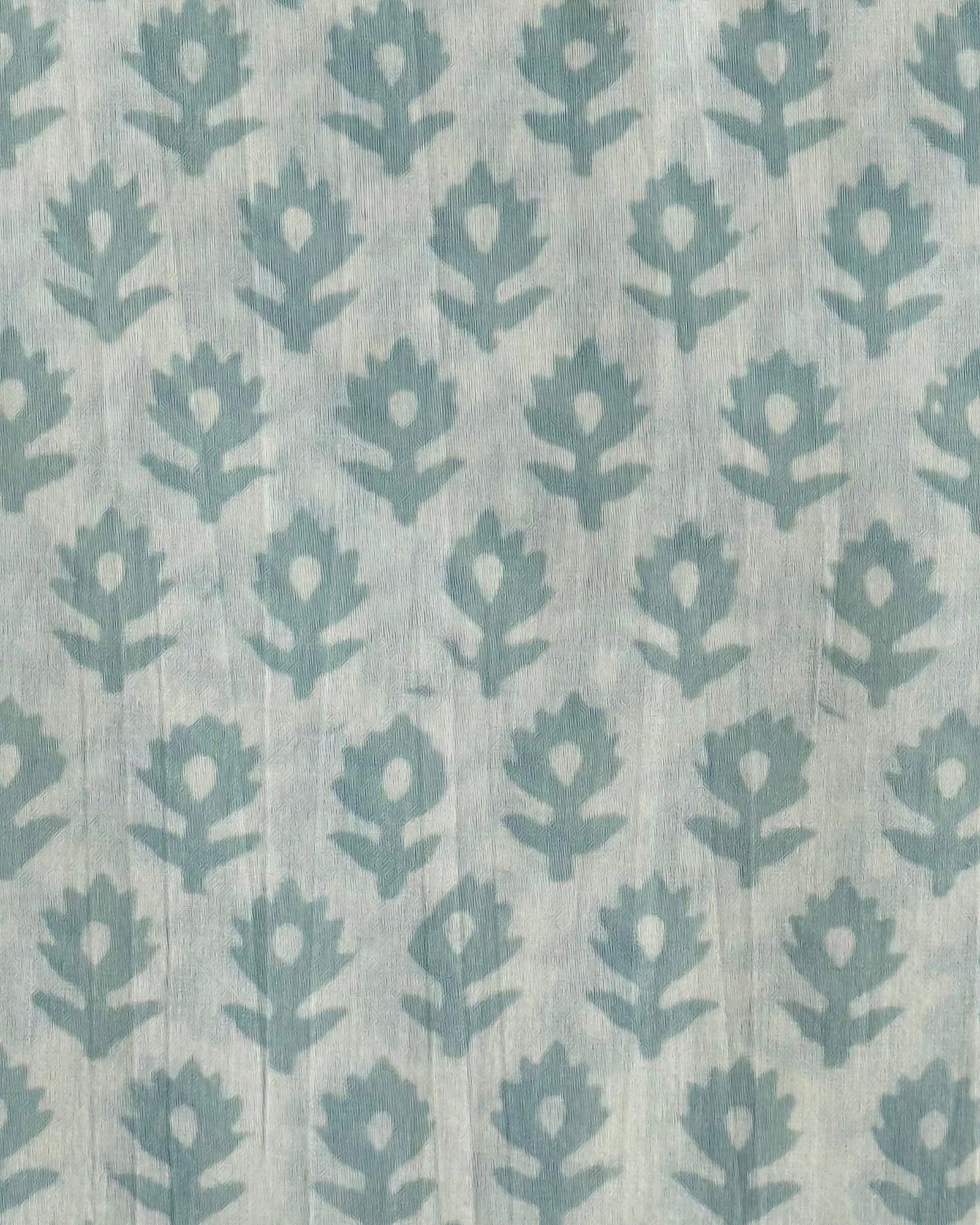  A close-up of our Heritage Buta block print fabric in a light mint  on a natural cotton background.