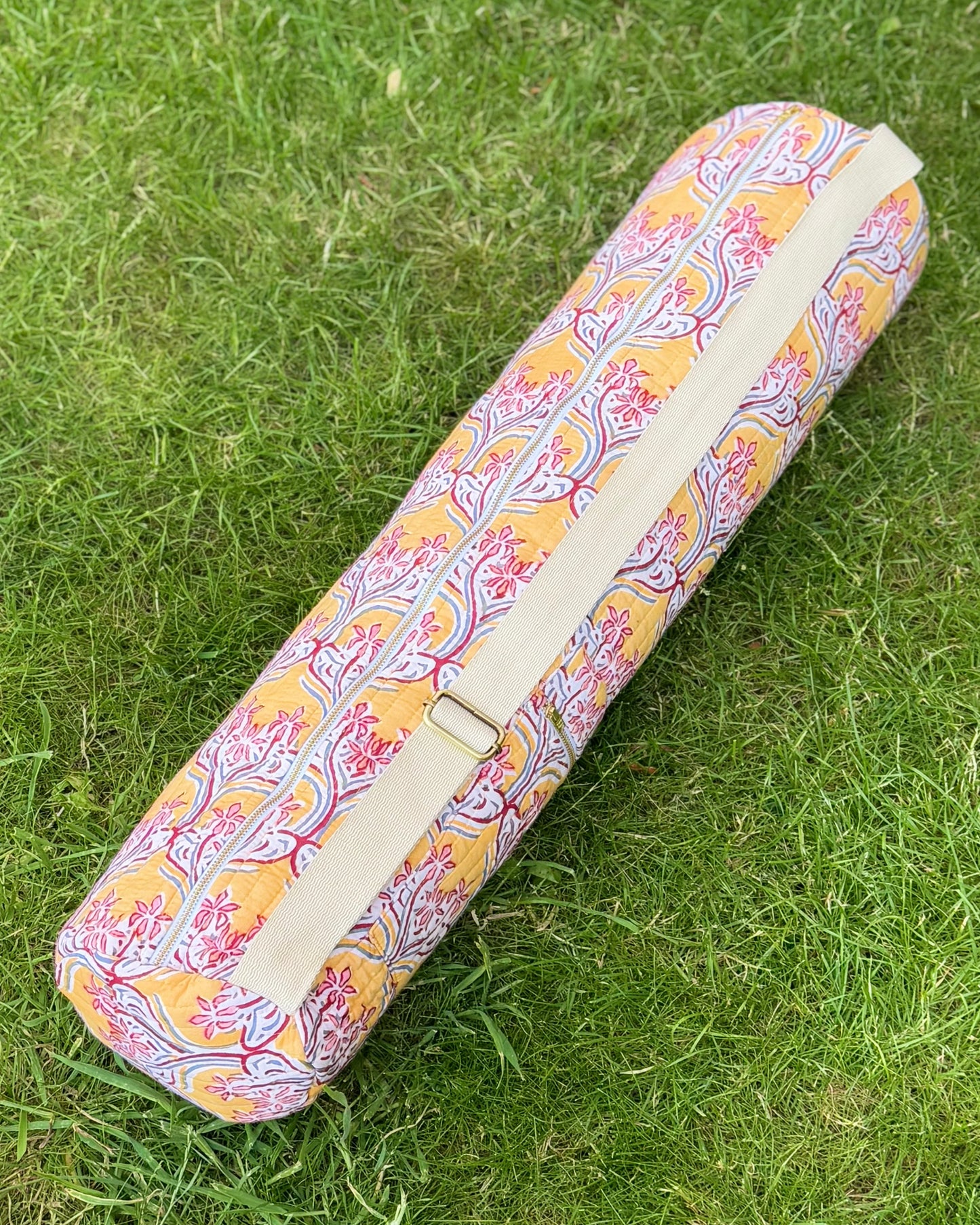 Yoga Mat cover with adjustable strap with floral pattern on grass