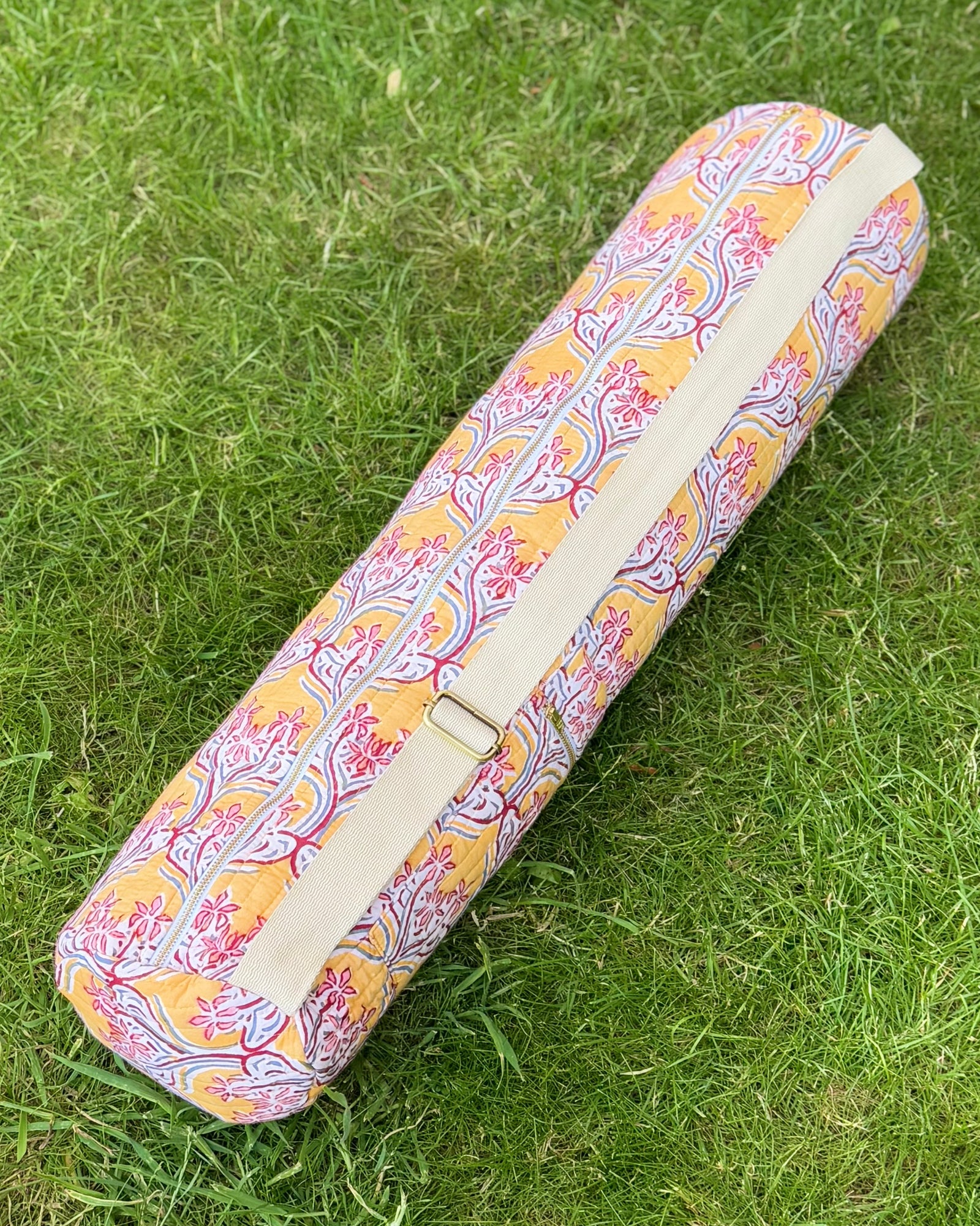 Yoga Mat cover with adjustable strap with floral pattern on grass