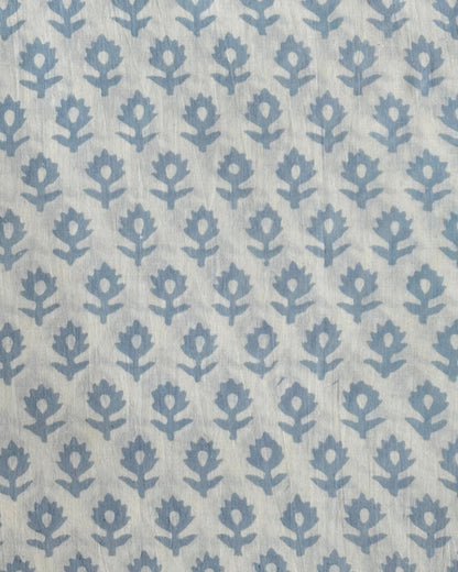 The Heritage Buta hand block print fabric in a classic sky blue, perfect for quilting and apparel.