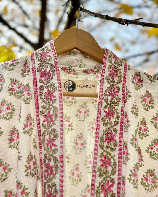Close-up detail of the Vintage Floral waffle robe collar and the Two Paisleys label.