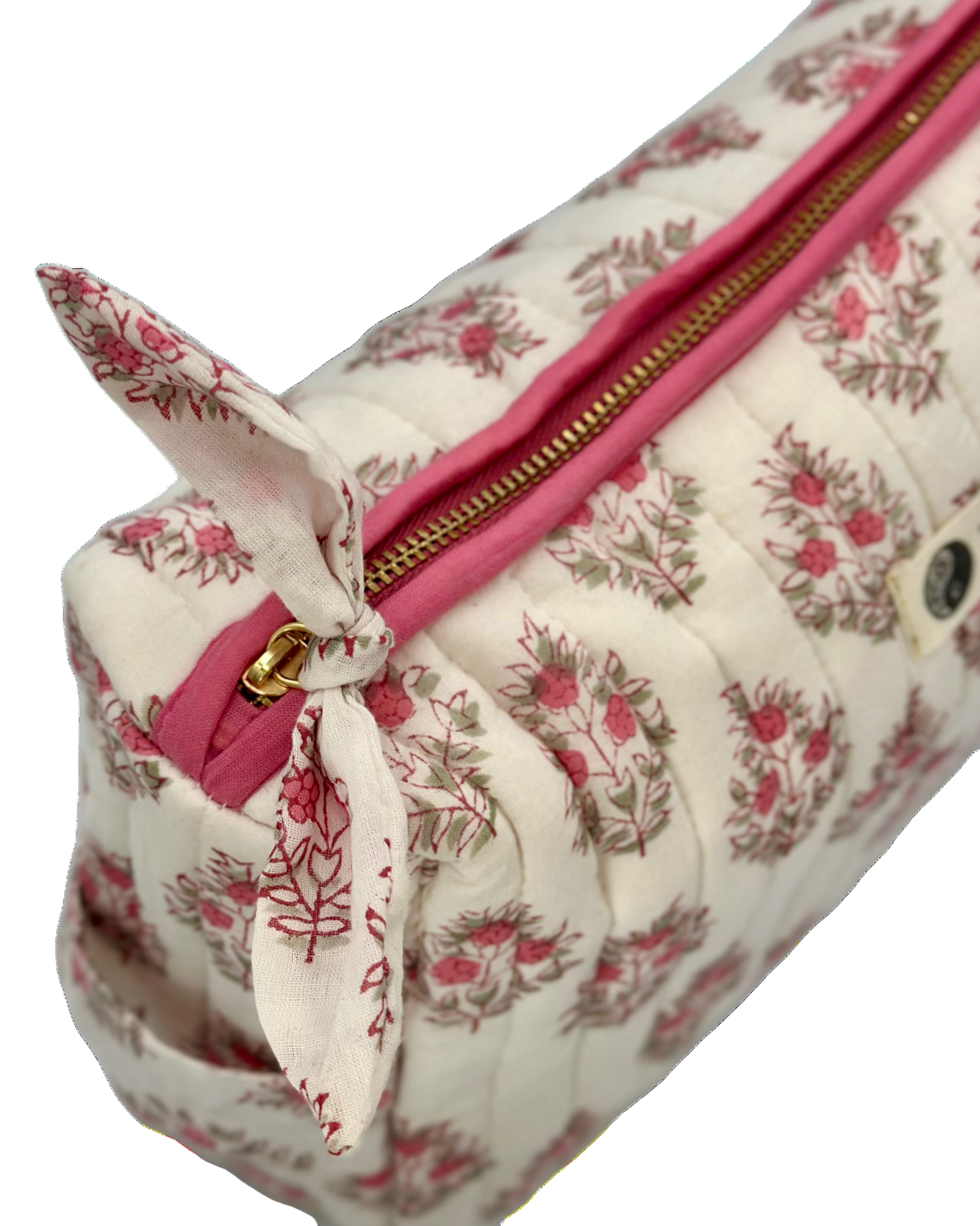 Close-up of gold zip and fabric knot detail on Vintage Floral Quilted Wash Bag.