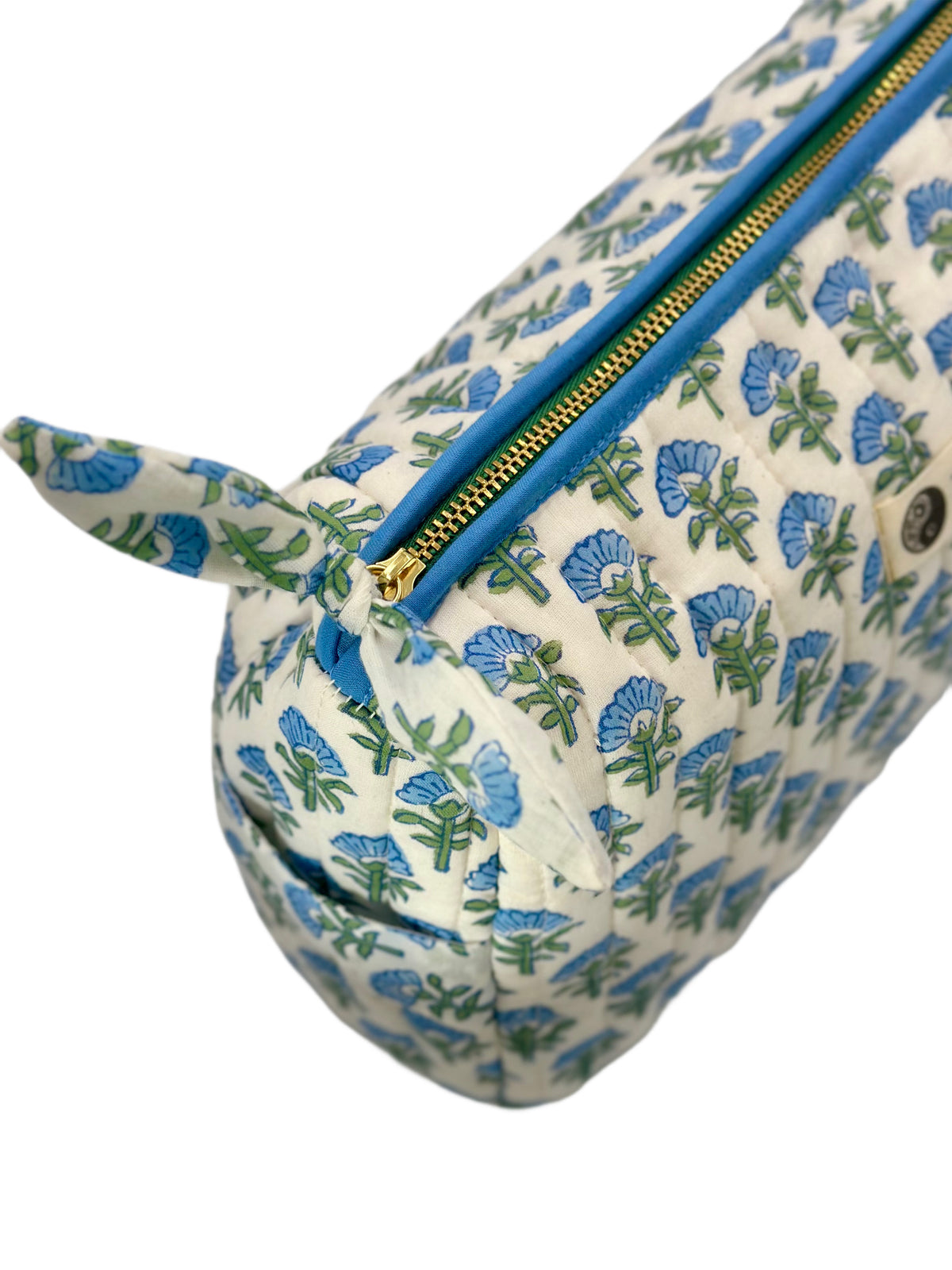 Topshot Of The Blue Blossom Quilted Makeup Bag Showing The Golden & Green Zip 
