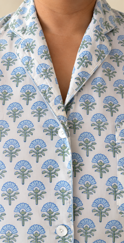 Close-up of notch collar and buttons on Two Paisleys hand block printed cotton pyjama shirt in blue floral pattern