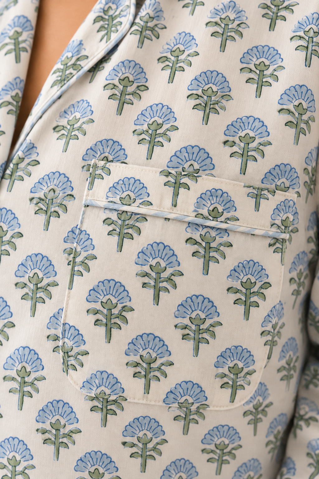Detailed view of the chest patch pocket and striped trim on Two Paisleys blue hand block printed pyjama shirt