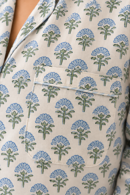 Detailed view of the chest patch pocket and striped trim on Two Paisleys blue hand block printed pyjama shirt