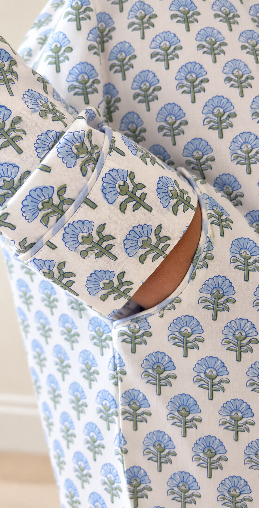  Detailed view of piping trim and side pocket on Two Paisleys blue block printed cotton pyjamas