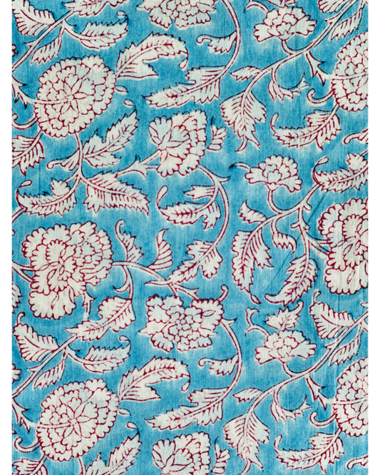 A close-up of the Blue Mughal Floral Hand Block Print Cotton Fabric, showcasing the intricate white and red floral design on a vibrant blue background