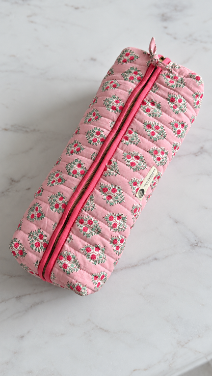Top shot of the of zipped up hair tools carry case in soft pink florals.