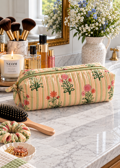  Green Stripe Floral quilted cotton hair tools bag in green and cream block print displayed on a marble bathroom vanity next to a candle and hairbrush