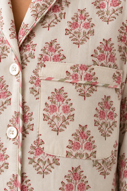 Detailed view of chest patch pocket and striped piping on Two Paisleys vintage pink floral block printed cotton pyjamas